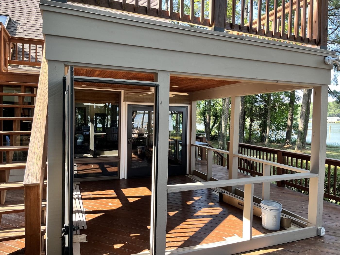 Before — open porch frame with screens removed during the rebuild