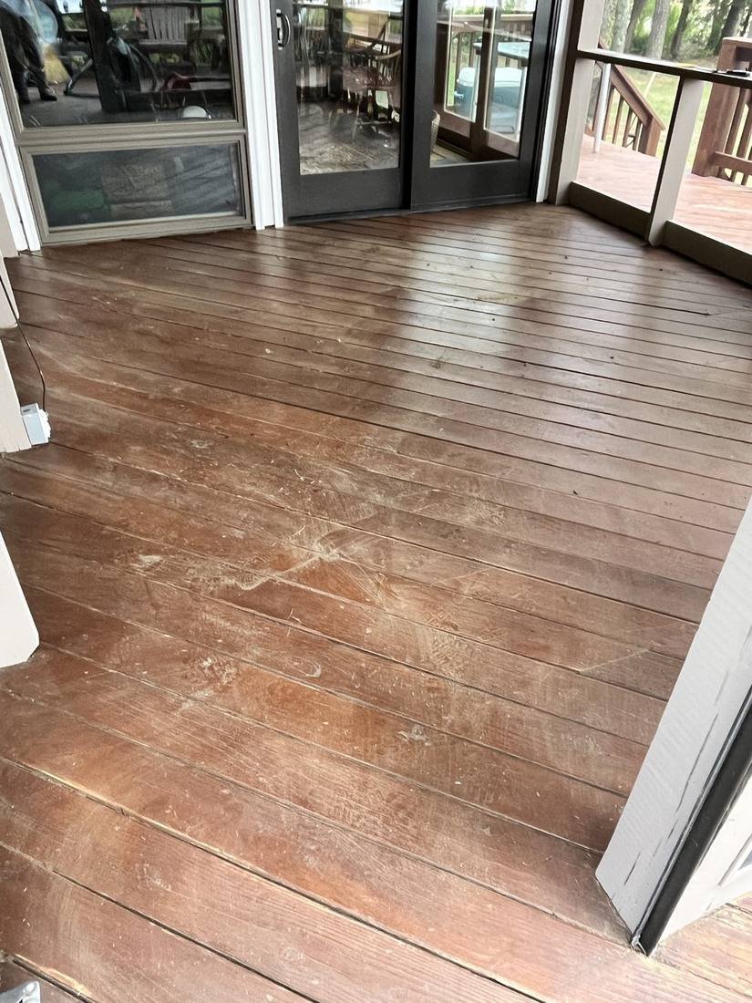 Before — worn screened porch floor with old dark screening