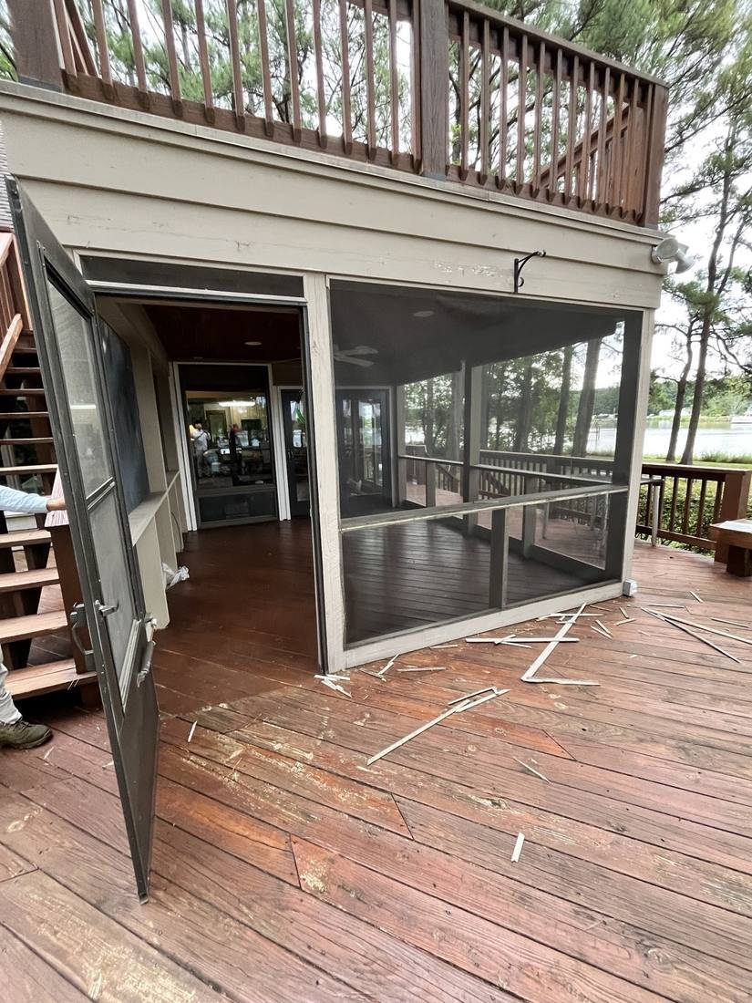 Before — old screen panels removed from the porch frame