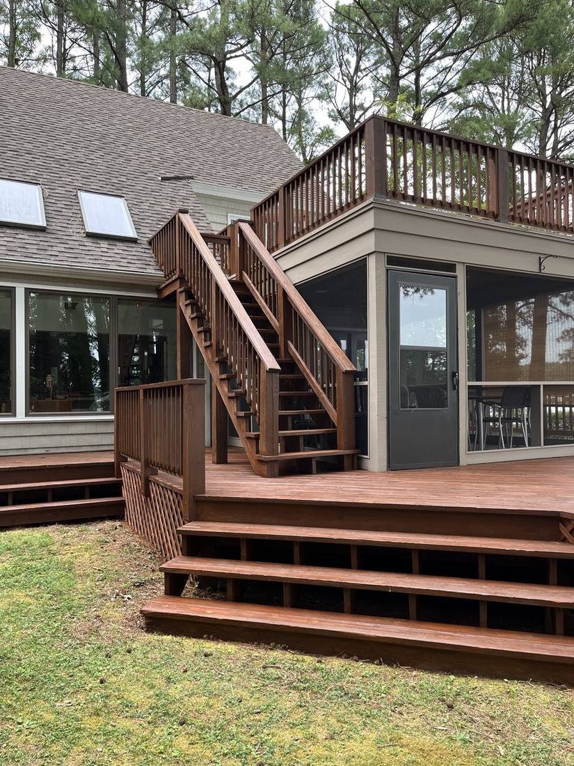 Rebuilt and repainted deck stairs and upper railing